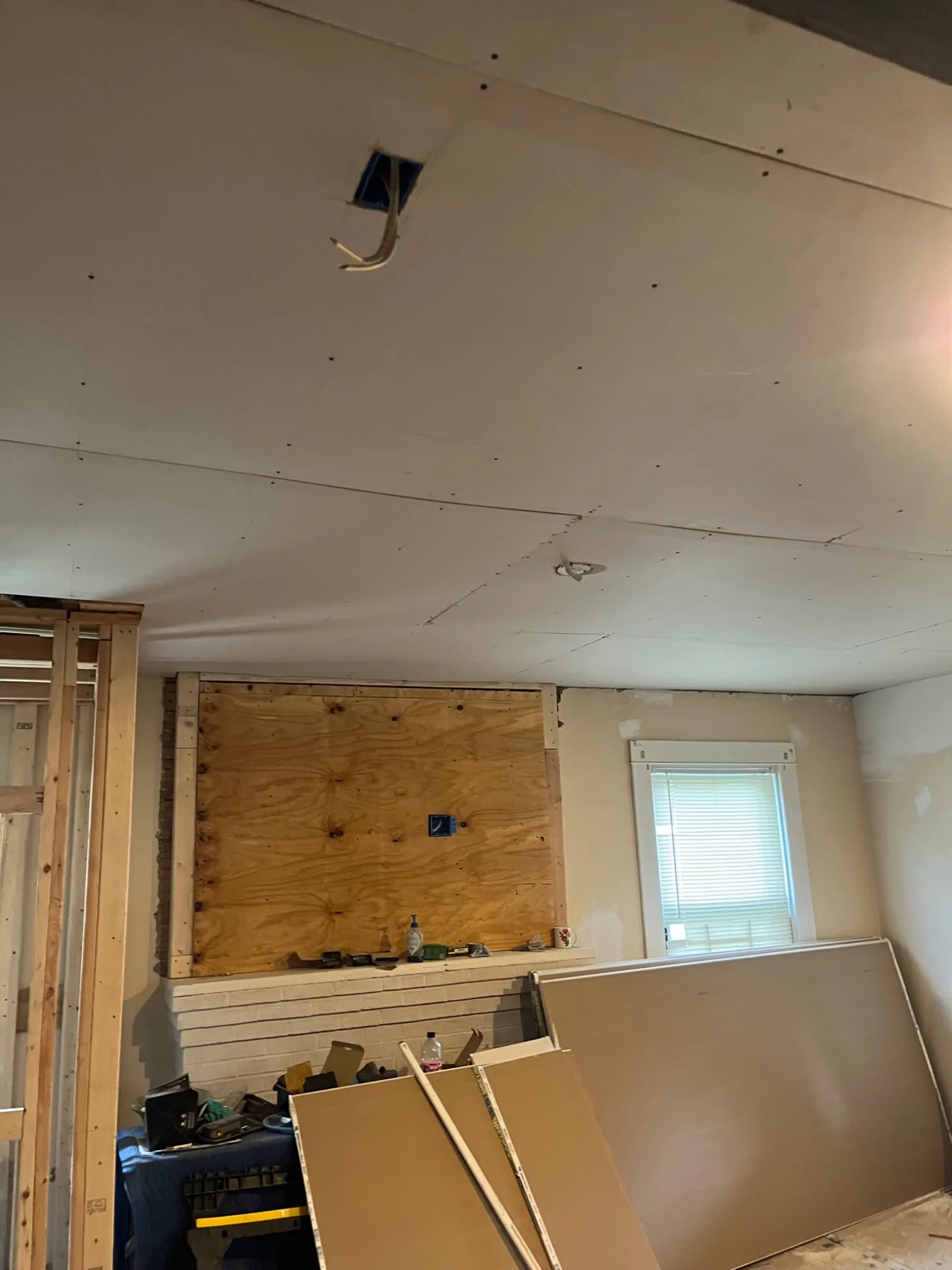 New drywall ceiling installation during renovation