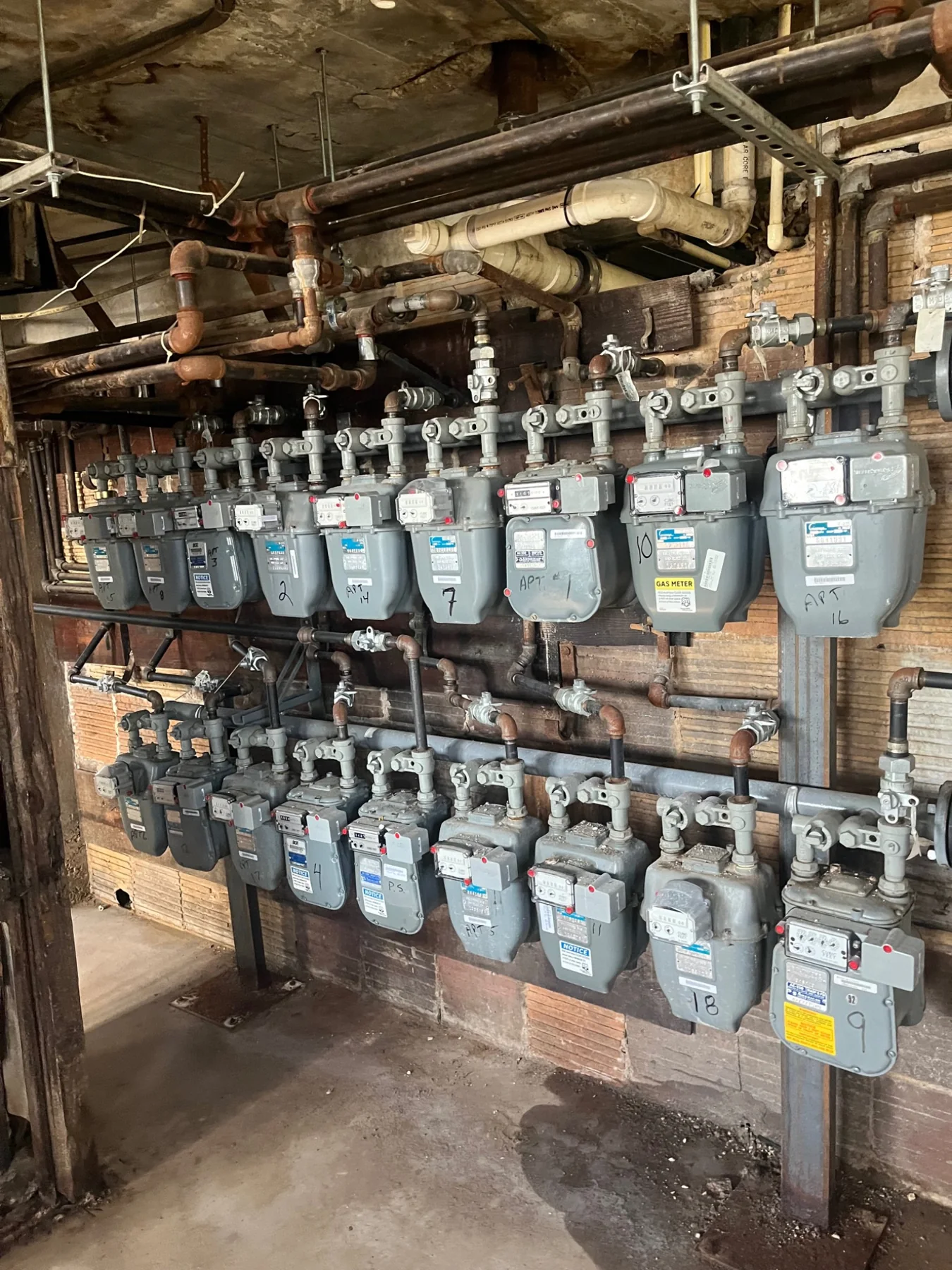 Multifamily gas meter bank and piping