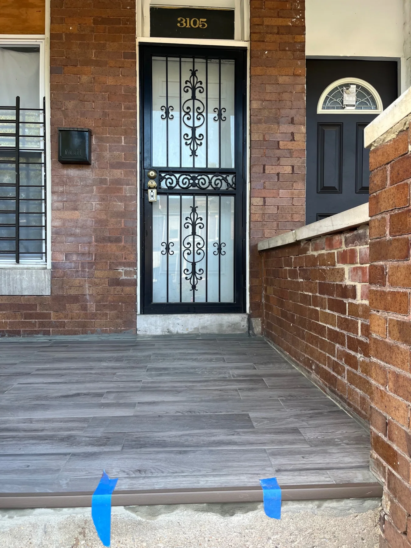 Completed tiled front porch at a Baltimore rowhome